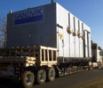 An E-House departs for installation on a coalyard stacker.
